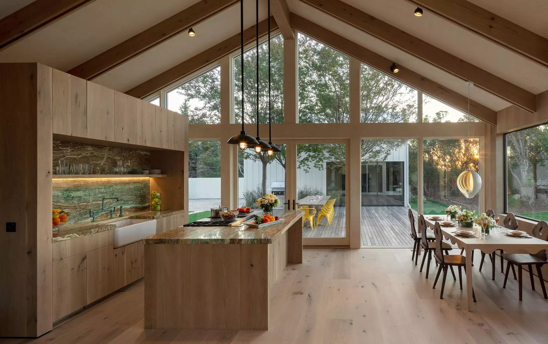 Josh AI Touch panel in a able with a traditional home in the background