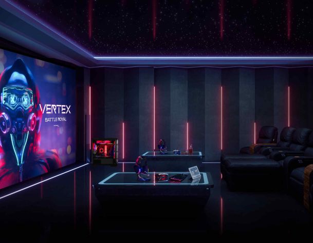 Home gaming lounge with a big screen, gaming PC, and neon LED lighting