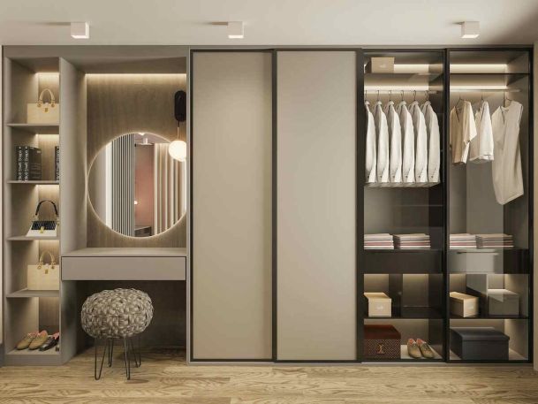 Luxury walk-in closet with a vanity and integrated LED accent lighting