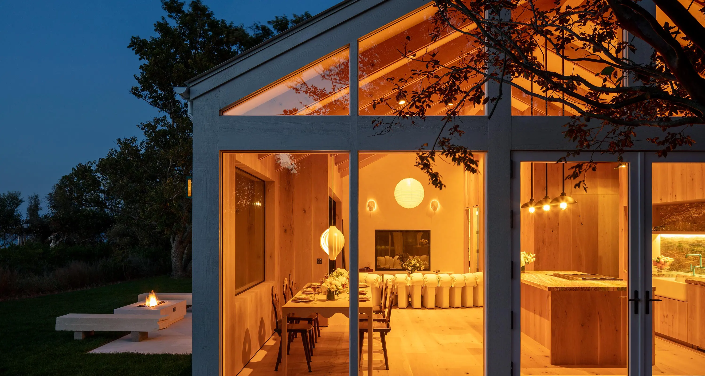 Josh AI Touch panel in a able with a traditional home in the background