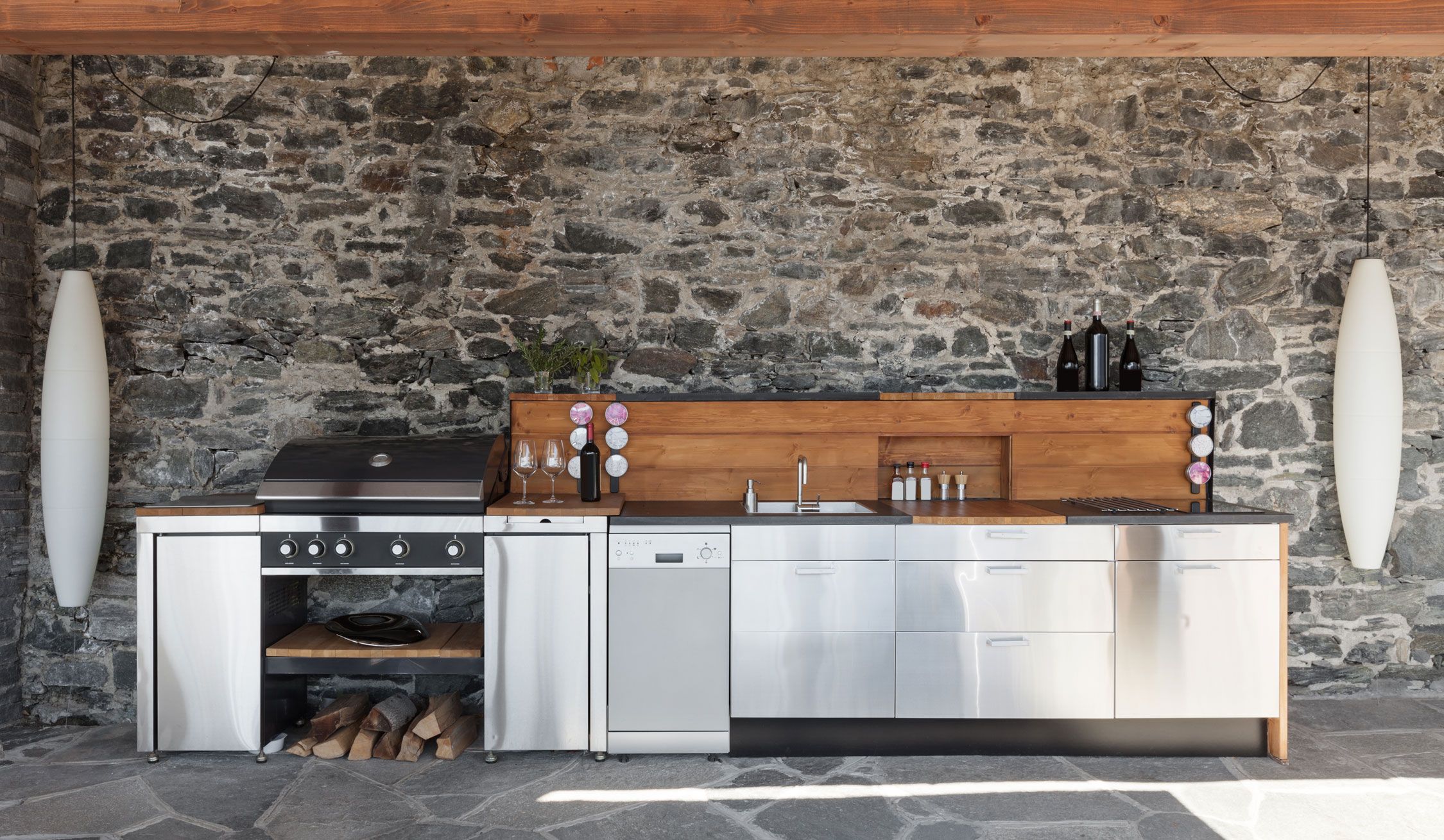 patio kitchen, stone wall, modern lighting